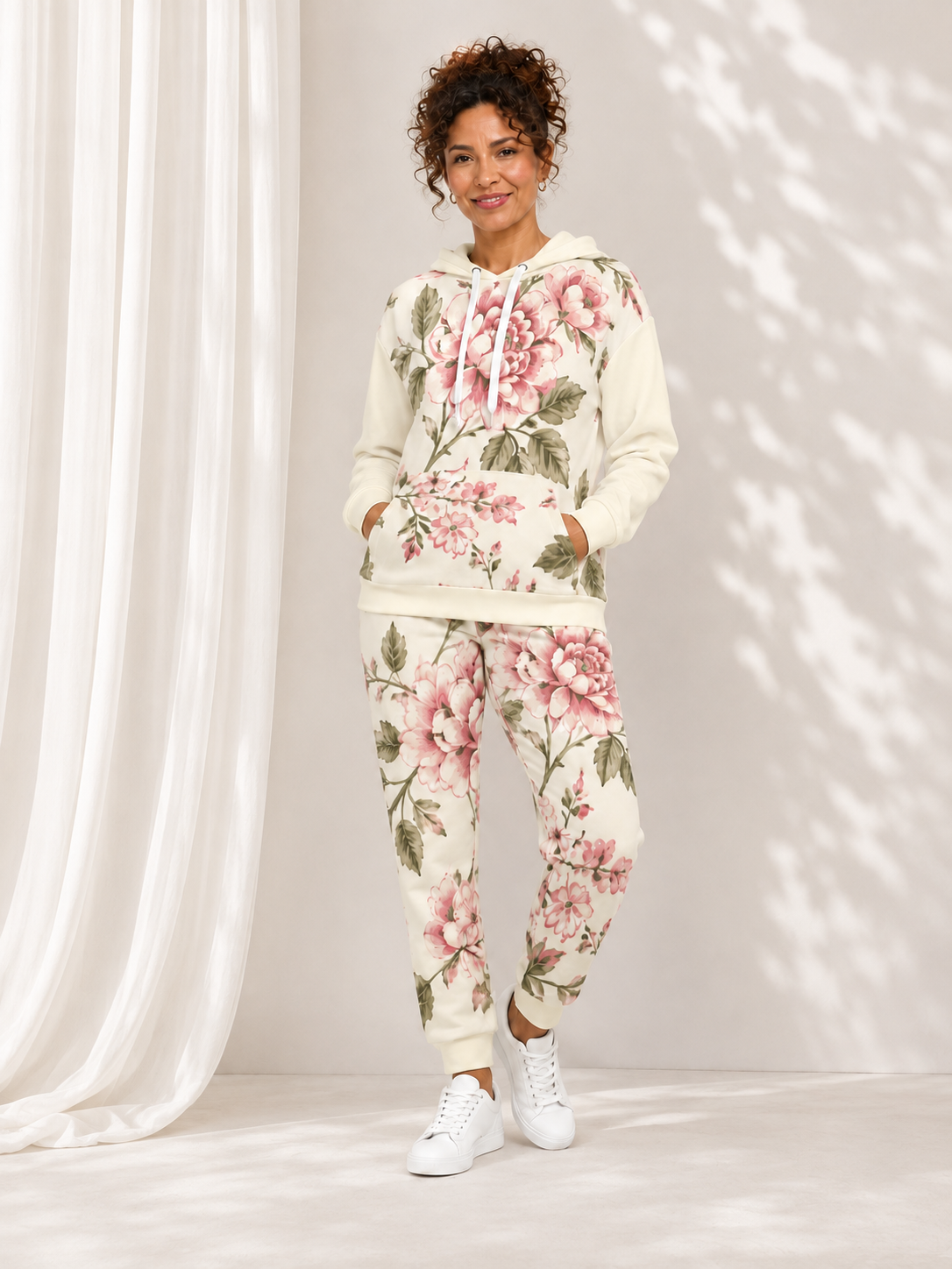 cream floral hoodie tracksuit set model front background
